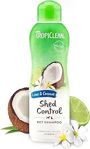 Bottle of TropiClean Lime & Coconut Shed Control Pet Shampoo, featuring images of coconut halves, a lime slice, and white tropical flowers around the base. The label highlights that it’s paraben-free and dye-free, designed to reduce shedding.